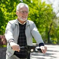 medium-shot-smiley-man-with-scooter_23-2148997267.jpg